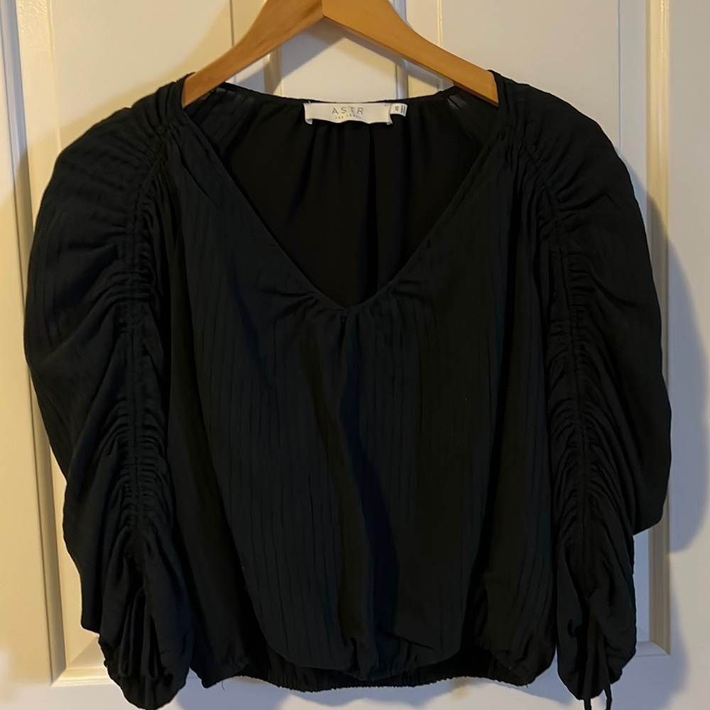 Black top with details on sleeve